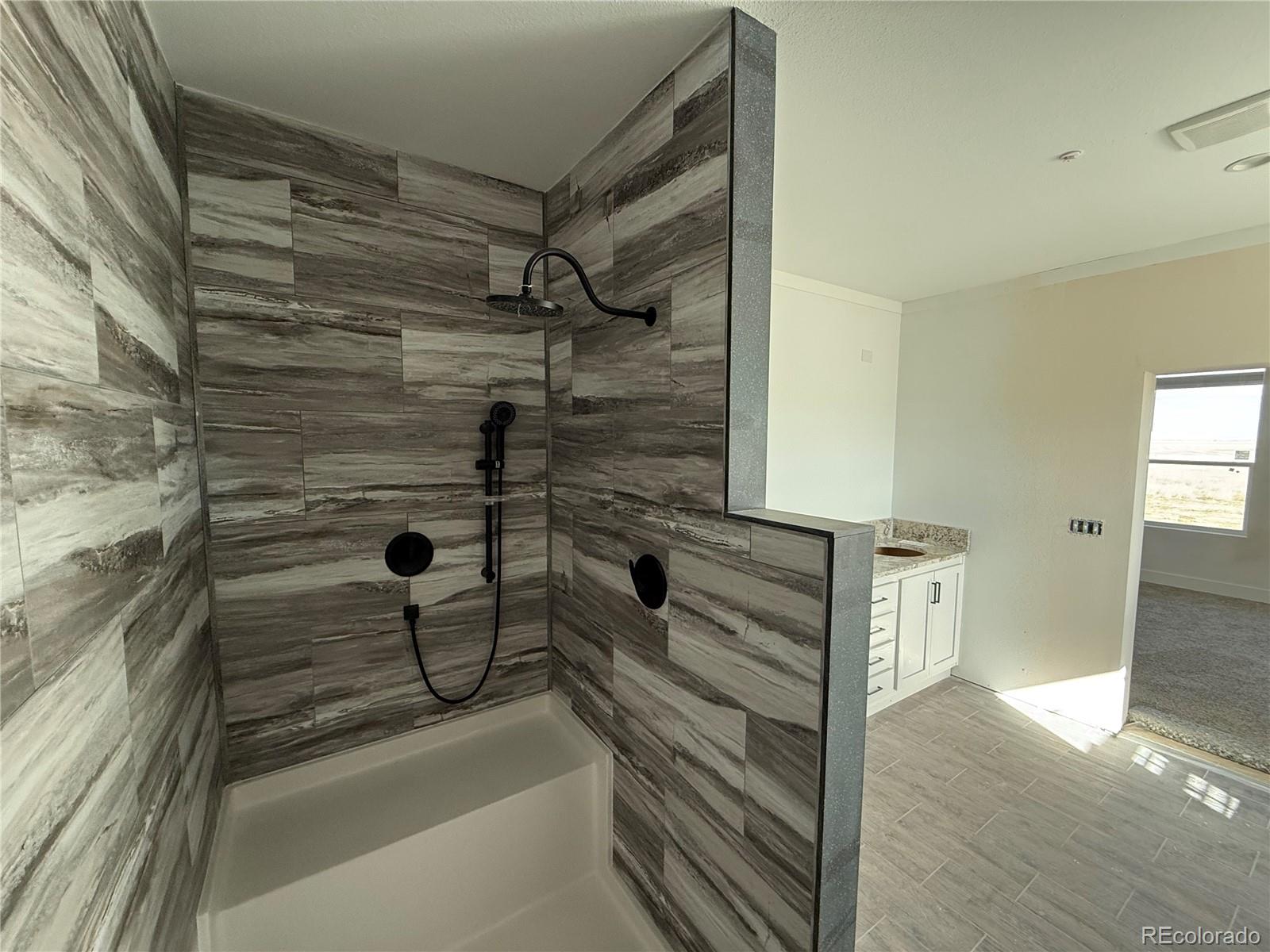 5117 Pass Me By Road Strasburg, CO 80136 - Photo 19 of 19 a view of walk in closet