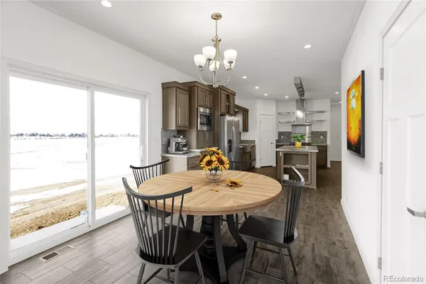 a view of a dining room with furniture window and wooden floor
