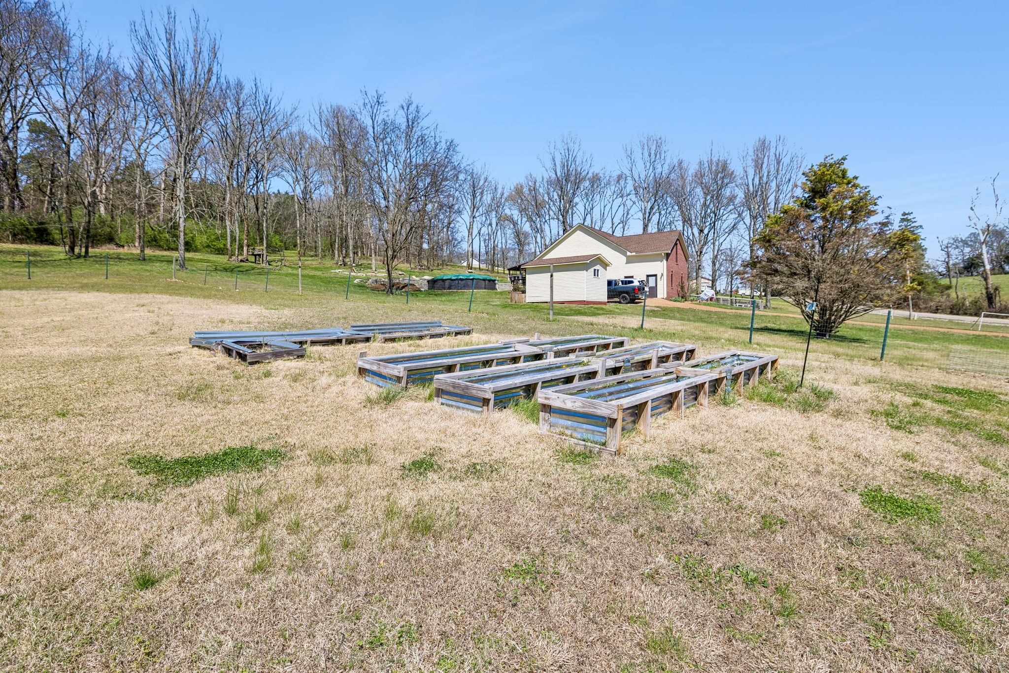 1245 Cliff Amos Road Spring Hill, TN 37174 - Photo 36 of 41 a view of a house with a yard and trees