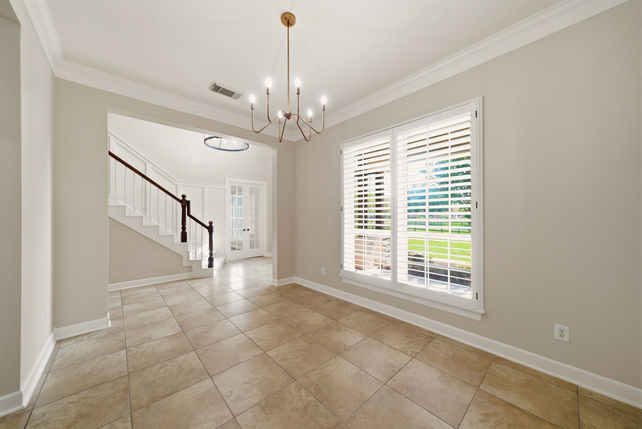 4535 Box Turtle Lane Fulshear, TX 77441 - Photo 13 of 49 Formal dining is conveniently located just off the entry, with easy access to the kitchen. Perfect for hosting and everyday meals alike.