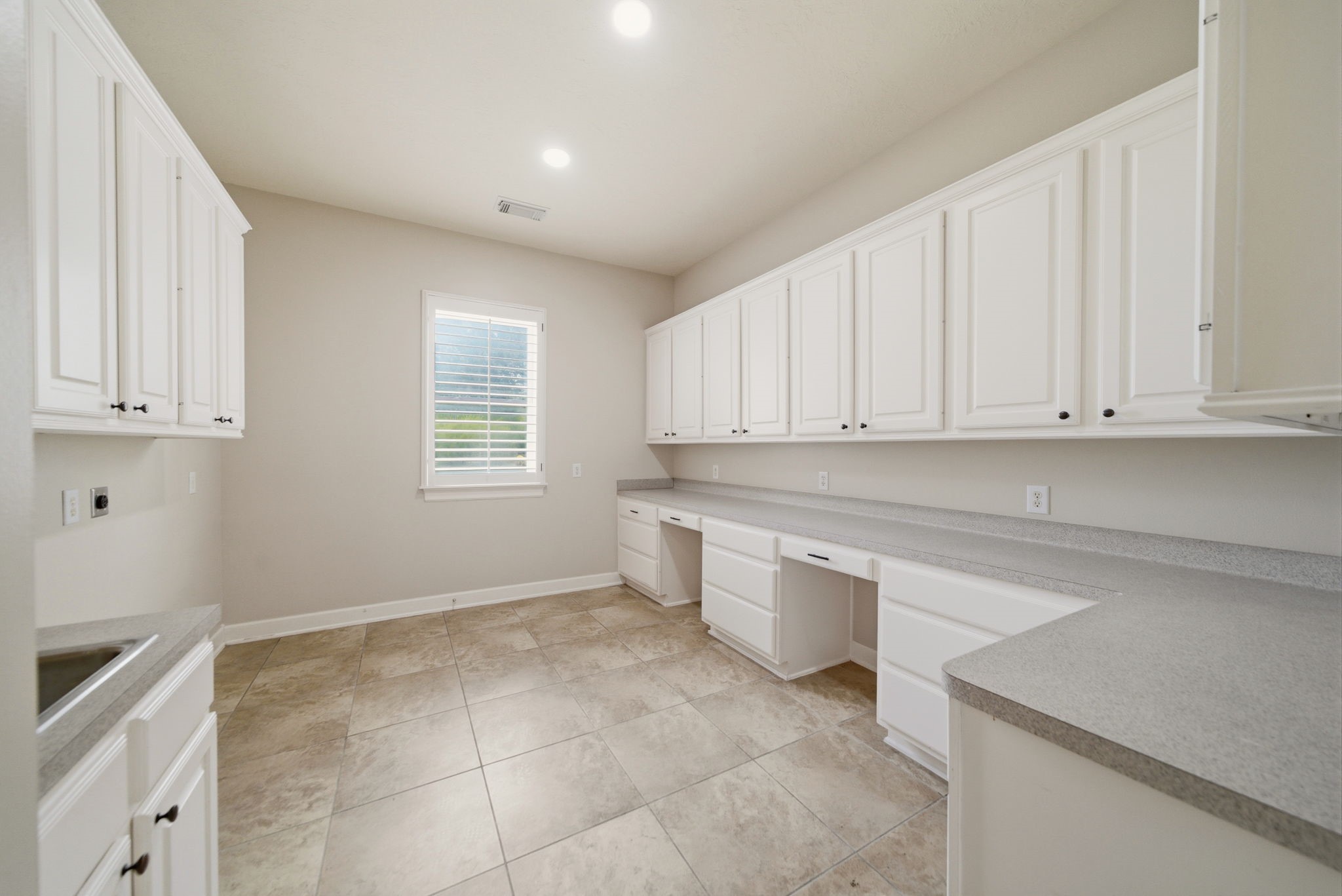 4535 Box Turtle Lane Fulshear, TX 77441 - Photo 16 of 49 21x12 laundry room with abundant cabinetry, generous counter space, and room for a refrigerator