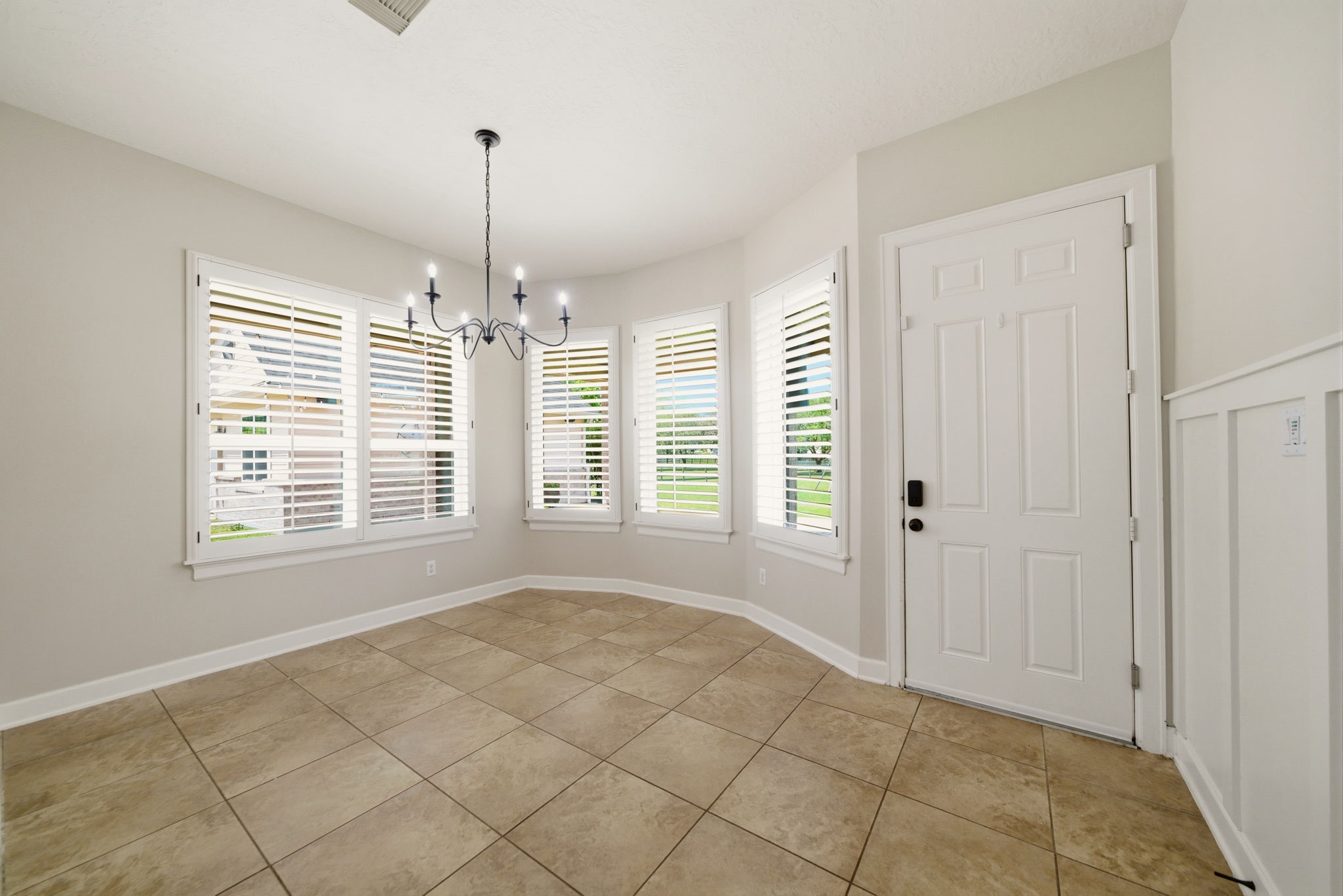 4535 Box Turtle Lane Fulshear, TX 77441 - Photo 20 of 49 Breakfast nook with easy access to the backyard, offering a bright and casual space to enjoy morning coffee with views of the outdoors.