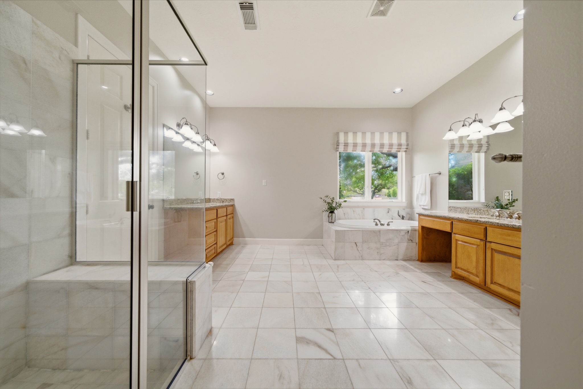 4535 Box Turtle Lane Fulshear, TX 77441 - Photo 27 of 49 Take in the spacious primary bath, offering an open layout with room to relax, unwind, and move comfortably throughout.