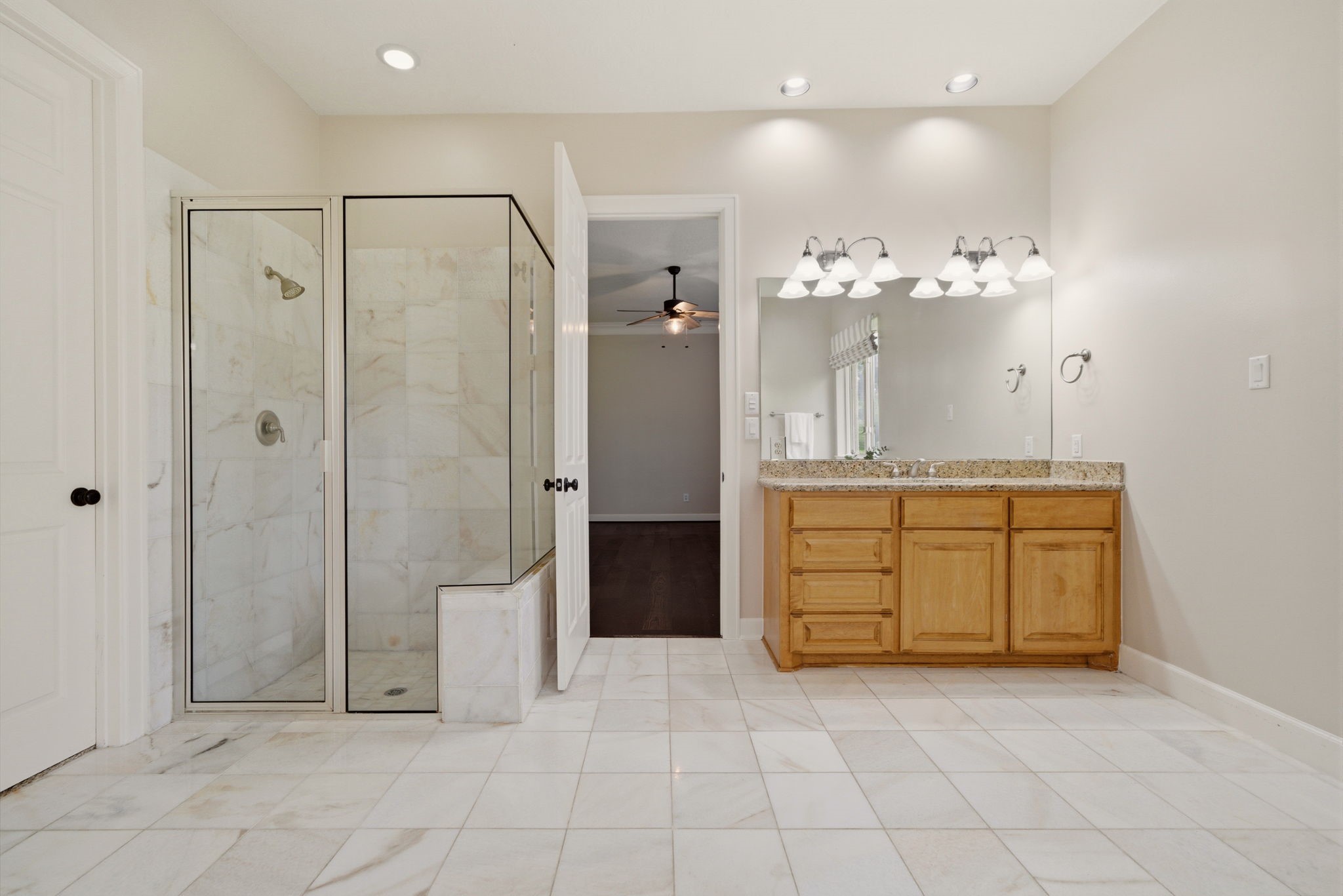 4535 Box Turtle Lane Fulshear, TX 77441 - Photo 28 of 49 Bright primary bath featuring a separate walk-in shower, designed to feel open, airy, and spa-like.