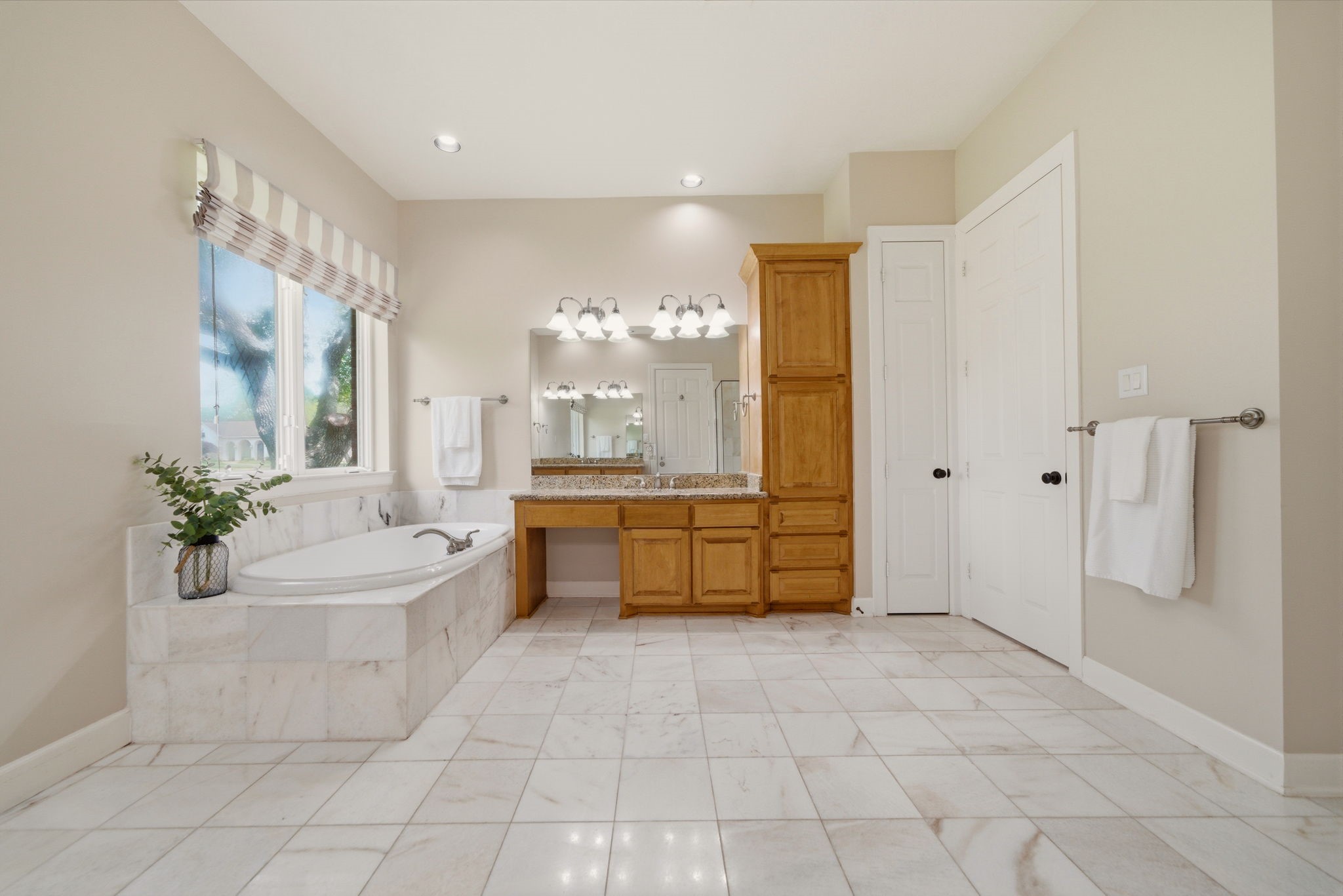 4535 Box Turtle Lane Fulshear, TX 77441 - Photo 29 of 49 Primary bath includes a separate soaking tub, double vanities, and plenty of space for comfort and convenience.