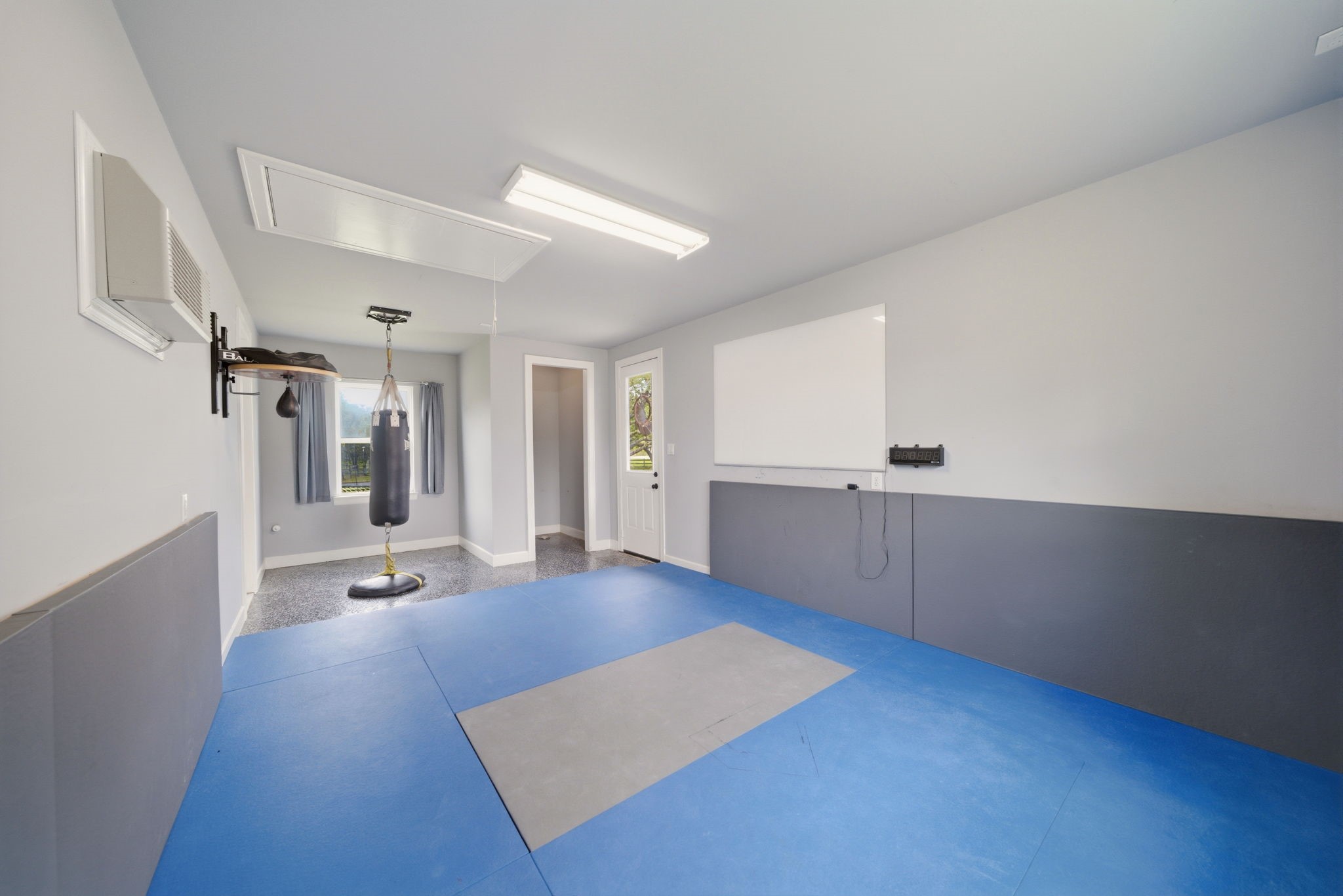 4535 Box Turtle Lane Fulshear, TX 77441 - Photo 31 of 49 25x12 home gym, fully air-conditioned, providing a comfortable and dedicated space for workouts year-round.