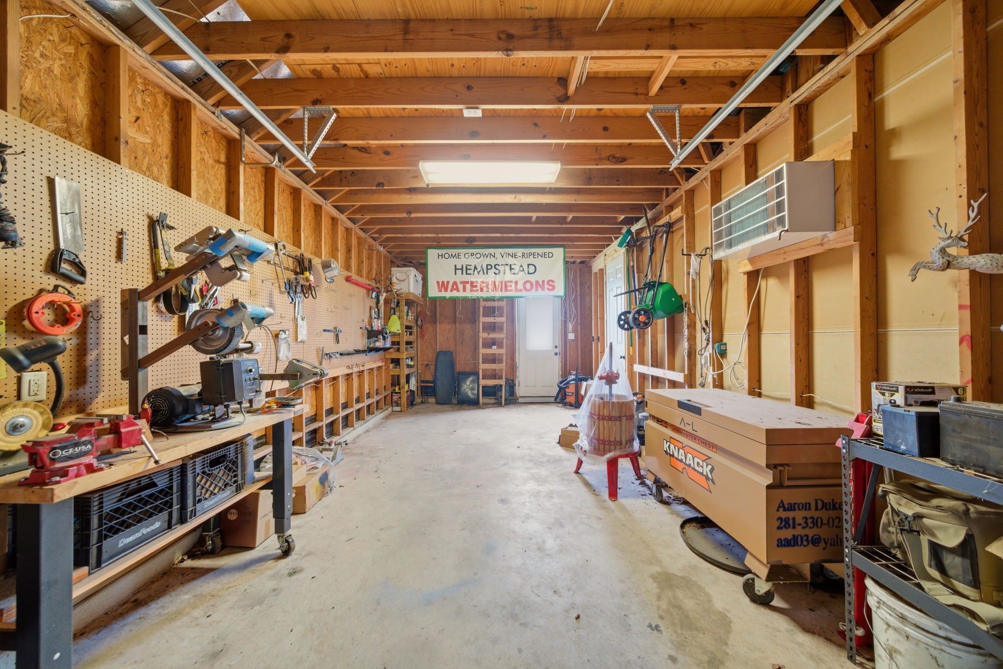 4535 Box Turtle Lane Fulshear, TX 77441 - Photo 32 of 49 Spacious workshop with ample storage, workbenches, and plenty of space for tools. Well-lit with exposed beams, it's perfect for DIY projects or hobbyists.