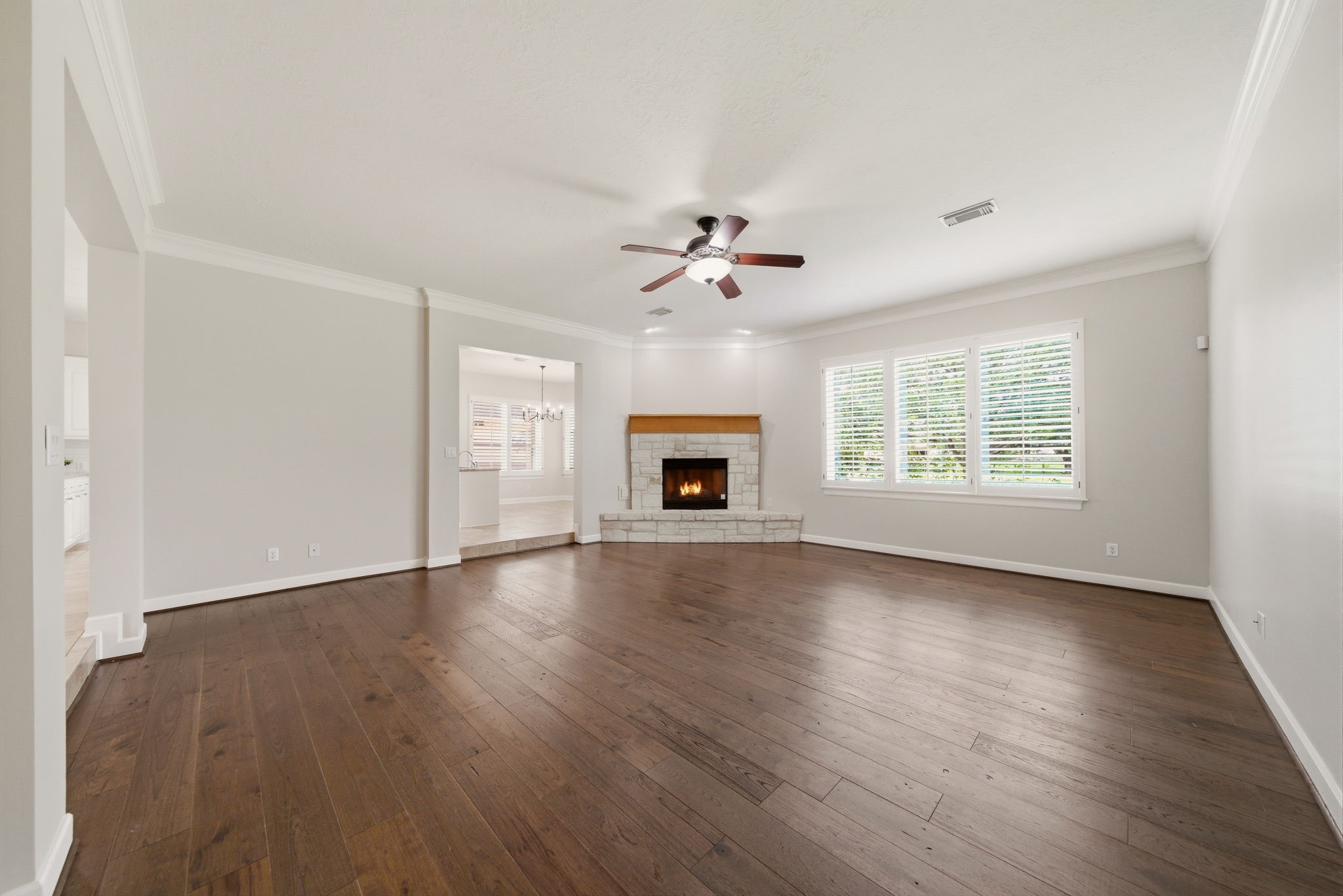 4535 Box Turtle Lane Fulshear, TX 77441 - Photo 4 of 49 The living room is conveniently positioned just off the kitchen and breakfast nook, creating a seamless flow ideal for both everyday living and entertaining.