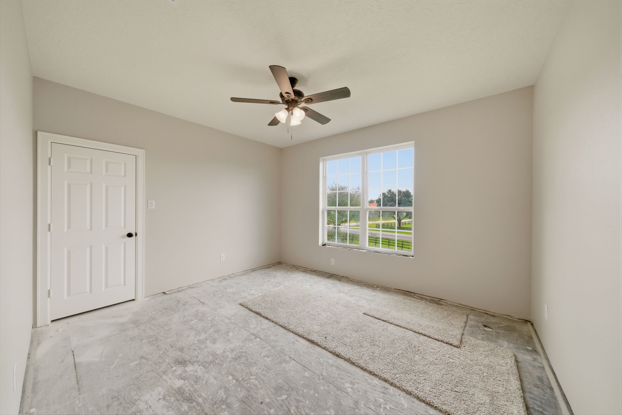 4535 Box Turtle Lane Fulshear, TX 77441 - Photo 42 of 49 The upstairs 5th Bedroom is almost complete with a recent tape, float, and paint. Choose your carpet and trim and you're done!