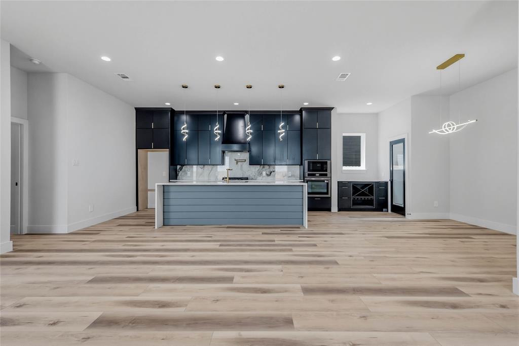 3914 Harlingen Street Dallas, TX 75212 - Photo 4 of 28 a view of kitchen and hall with wooden floor