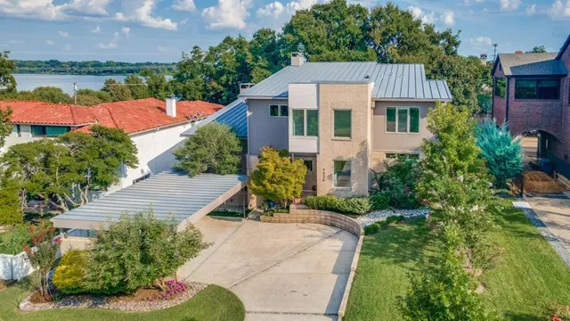 a aerial view of a house with a yard and a garden
