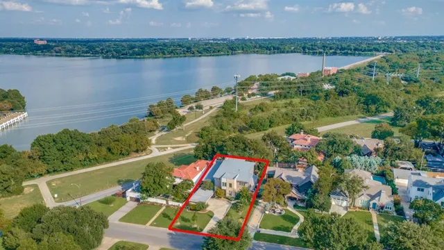 a view of a lake with a house in the background