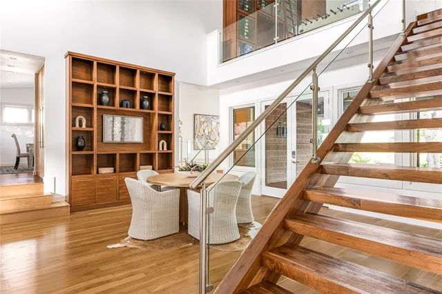 a view of entryway and hall with wooden floor