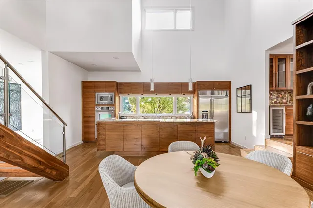 a view of a dining room with furniture window and wooden floor