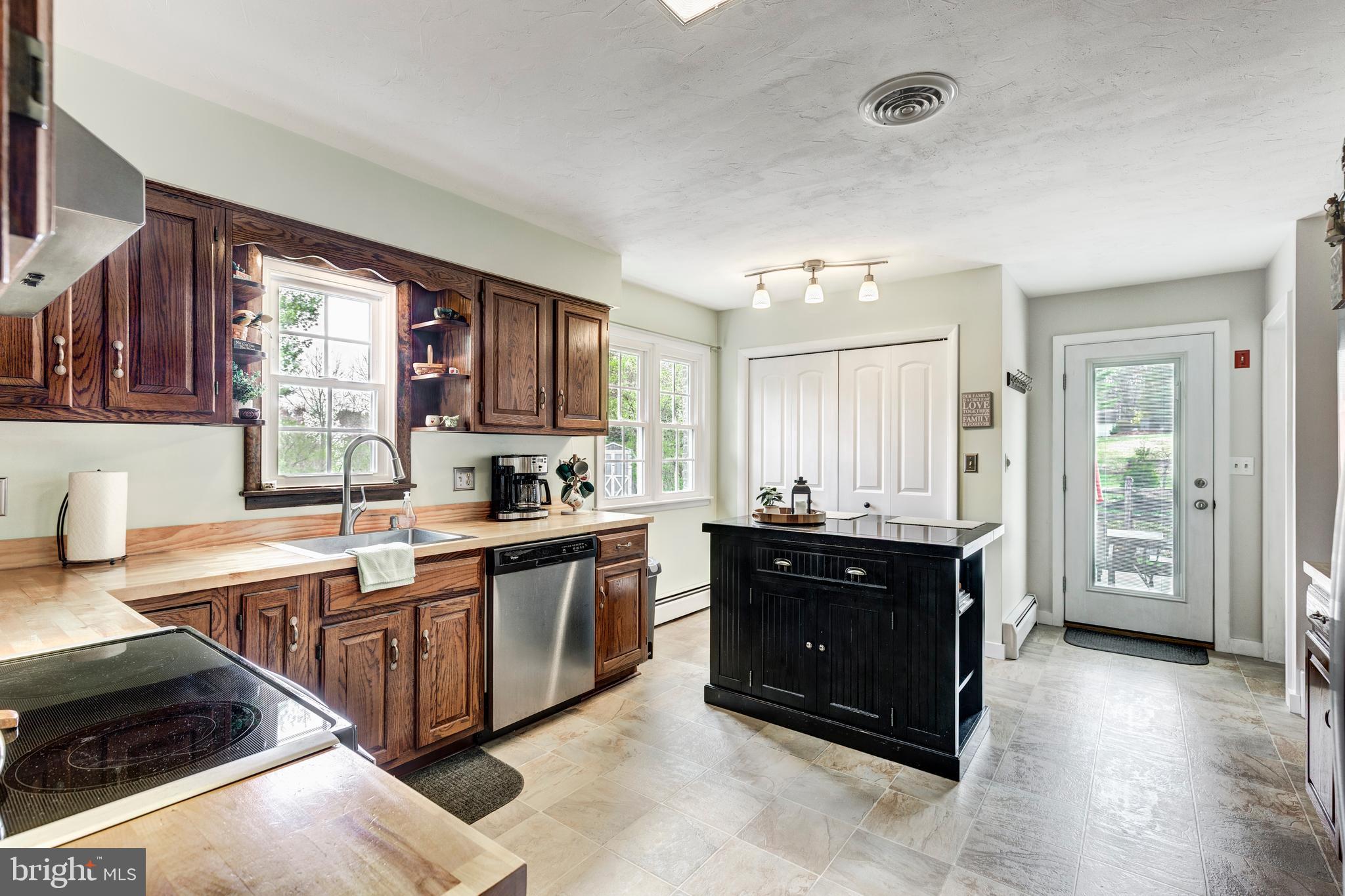 3144 Coon Club Road Hampstead, MD 21074 - Photo 27 of 64 a large kitchen with stainless steel appliances granite countertop a sink and cabinets