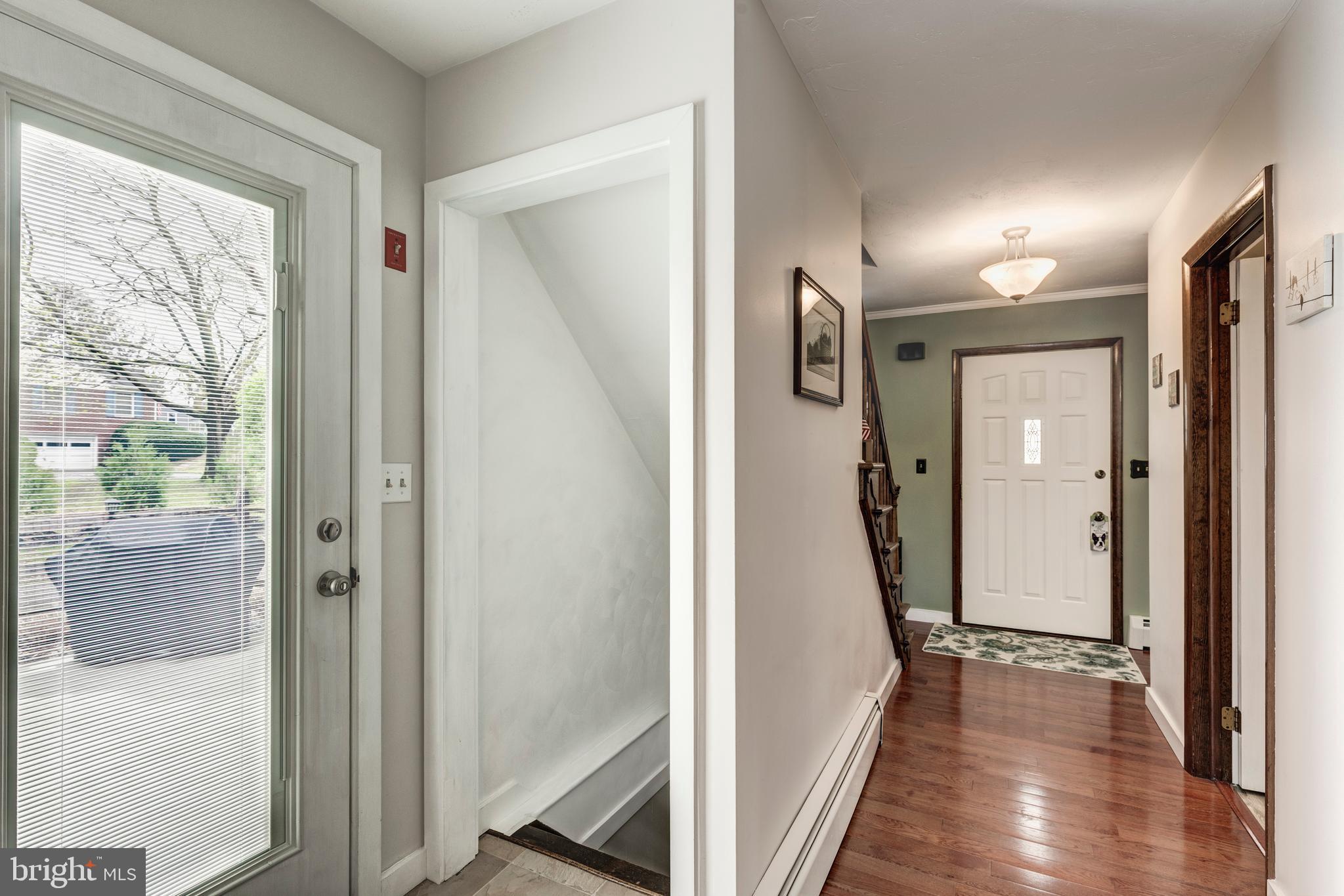 3144 Coon Club Road Hampstead, MD 21074 - Photo 40 of 64 a view of a hallway with wooden floor and a bathroom