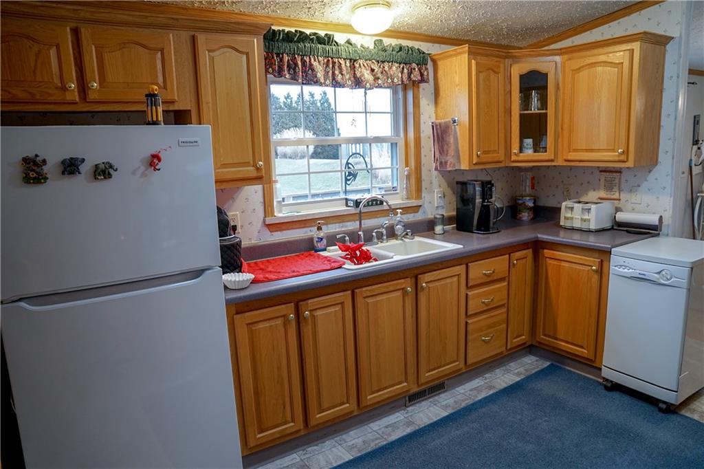 226 Rieger Road Butler, PA 16001 - Photo 13 of 23 a white refrigerator freezer sitting inside of a kitchen