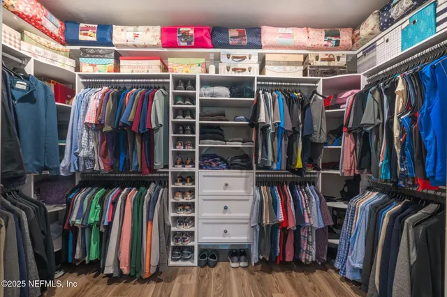 a bathroom with a sink toilet vanity and shower