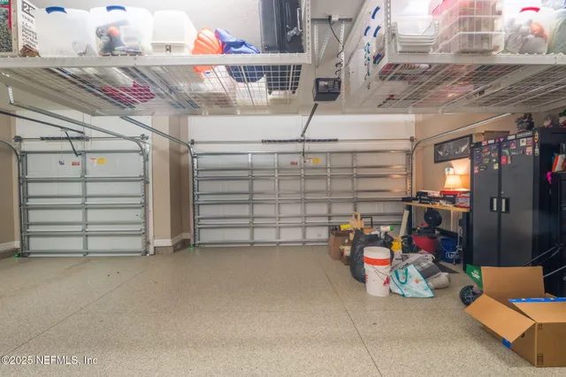 a kitchen with stainless steel appliances granite countertop a kitchen island a stove a table and chairs in it