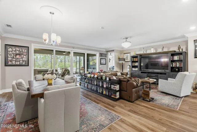 a living room with lots of furniture and a rug