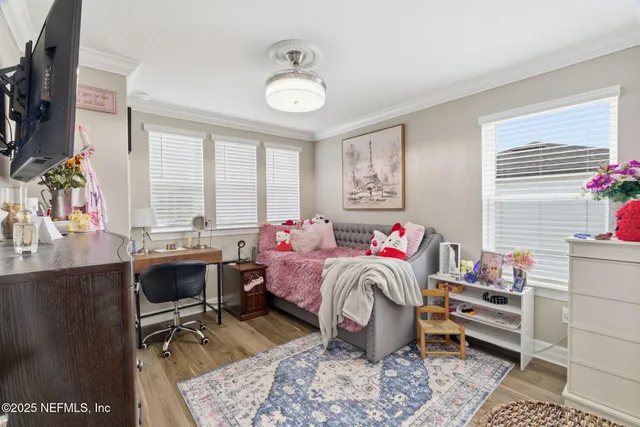 a view of a swimming pool with a patio and a yard