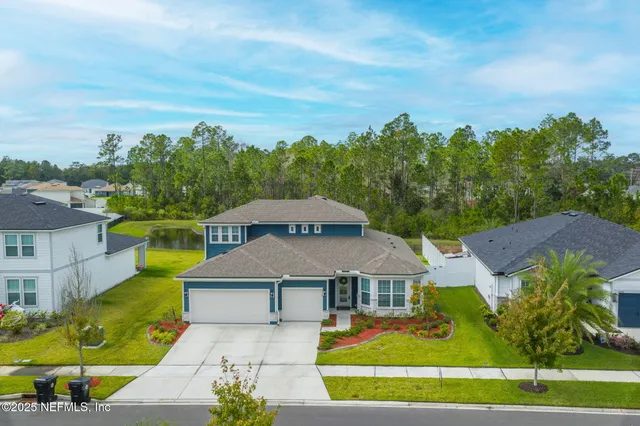 a view of a house with a big yard