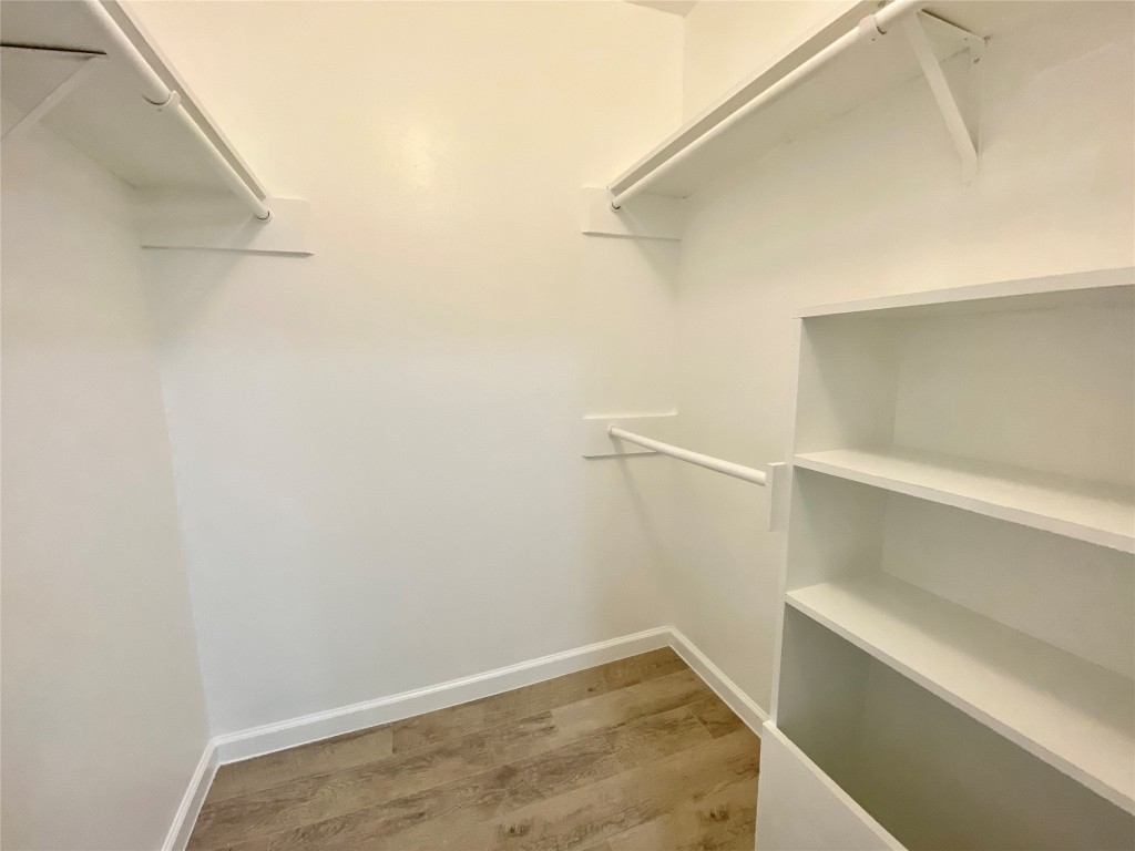 807 Blanco Street, Unit 304 Austin, TX 78703 - Photo 17 of 21 Walk in closet with light wood-style flooring