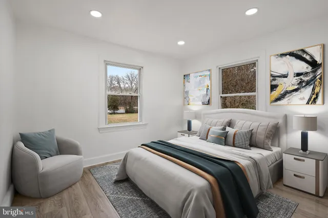 a bedroom with bed couch and window