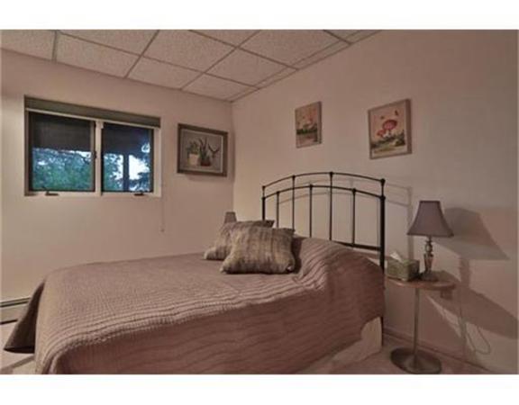 26 River Road Merrimac, MA 01860 - Photo 23 of 29 a bedroom with a bed and window