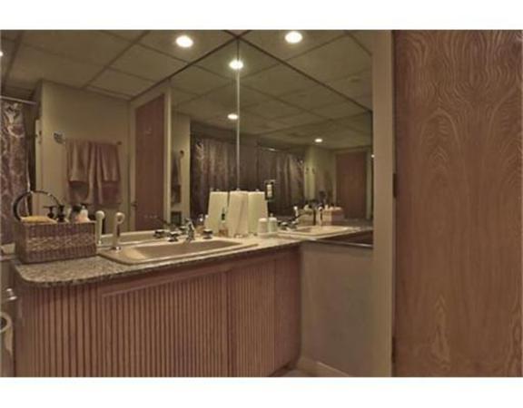 26 River Road Merrimac, MA 01860 - Photo 25 of 29 a bathroom with a sink and a mirror