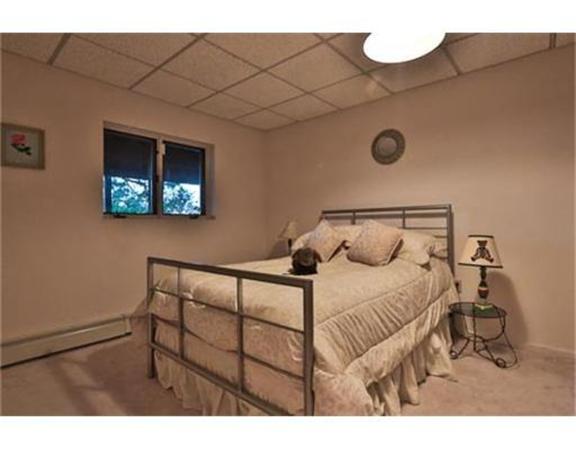 26 River Road Merrimac, MA 01860 - Photo 27 of 29 a bedroom with a bed and a night stand