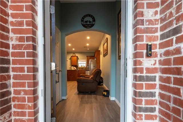 a view of a bathroom with a shower and a mirror