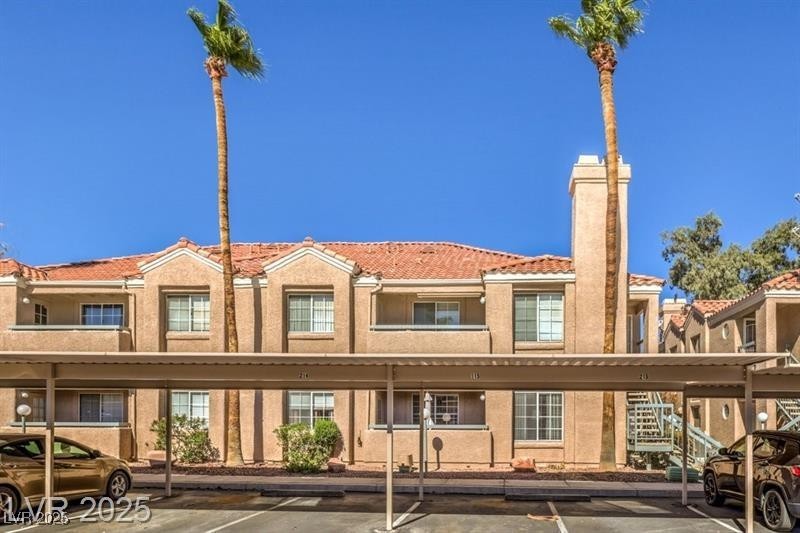 Undisclosed Address Las Vegas, NV 89119 - Photo 8 of 8 View of building exterior featuring covered parkin