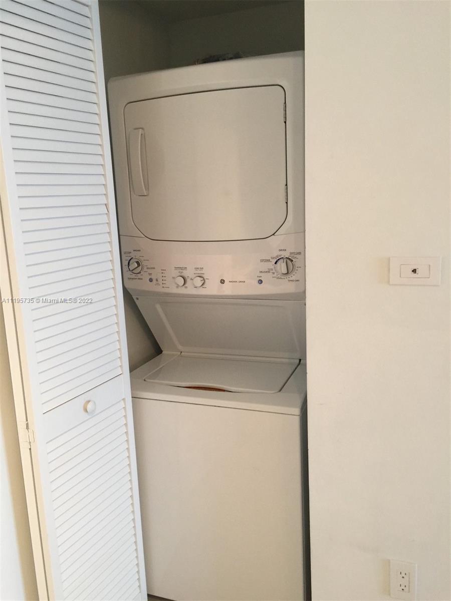 2602 East Hallandale Beach Boulevard, Unit R407 Hallandale Beach, FL 33009 - Photo 39 of 39 a utility room with dryer and washer