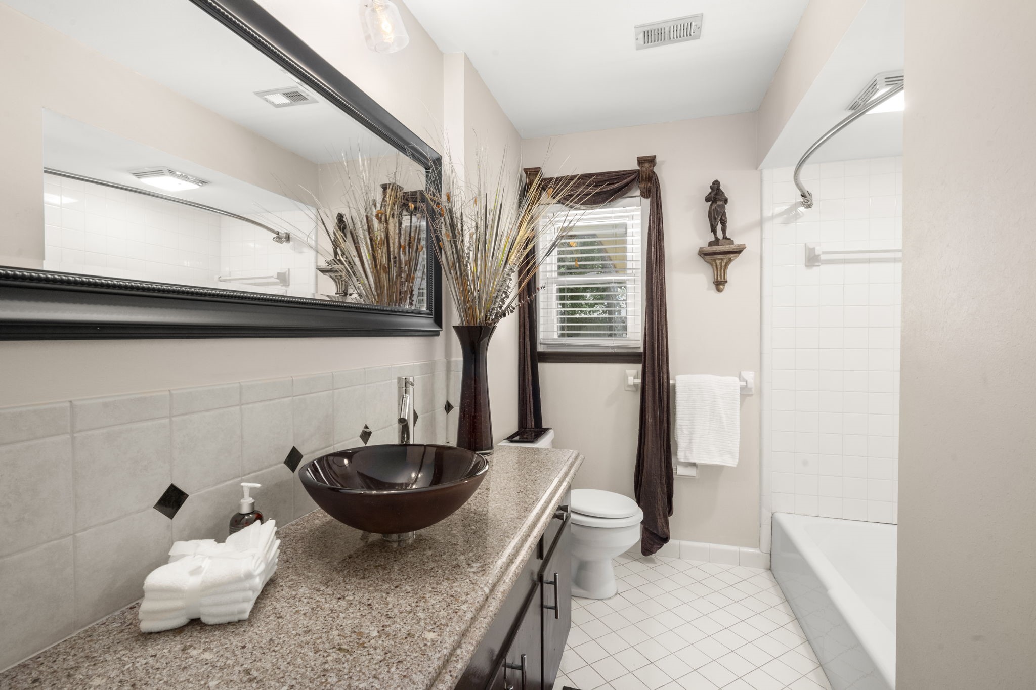 2506 Teague Road Houston, TX 77080 - Photo 24 of 33 a bathroom with a granite countertop sink and a mirror
