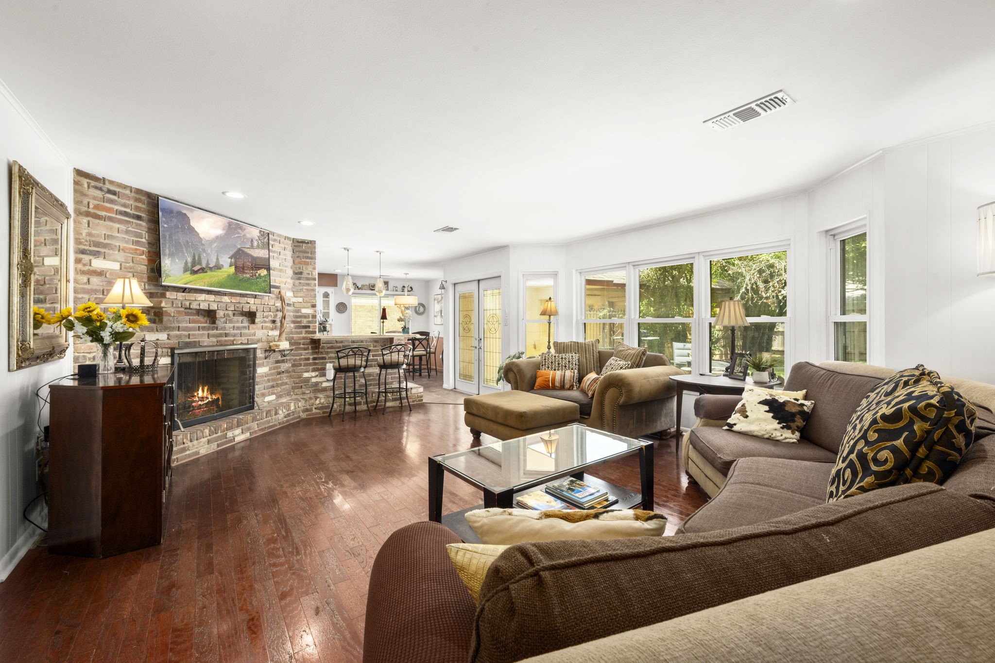 2506 Teague Road Houston, TX 77080 - Photo 7 of 33 a living room with furniture fireplace and a large window
