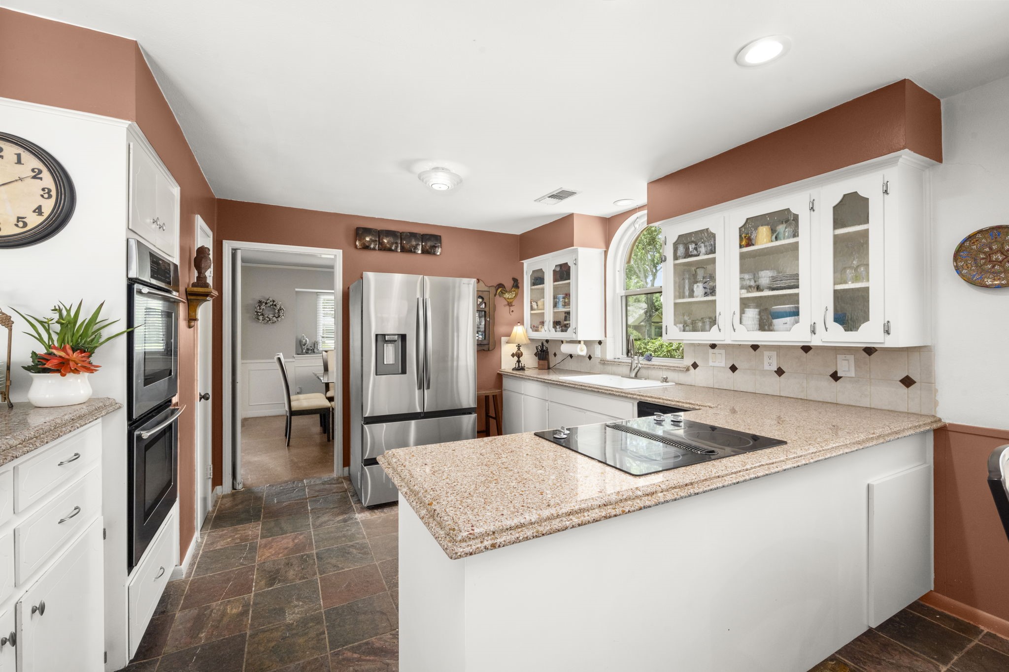 2506 Teague Road Houston, TX 77080 - Photo 8 of 33 a kitchen with stainless steel appliances granite countertop a sink and a refrigerator