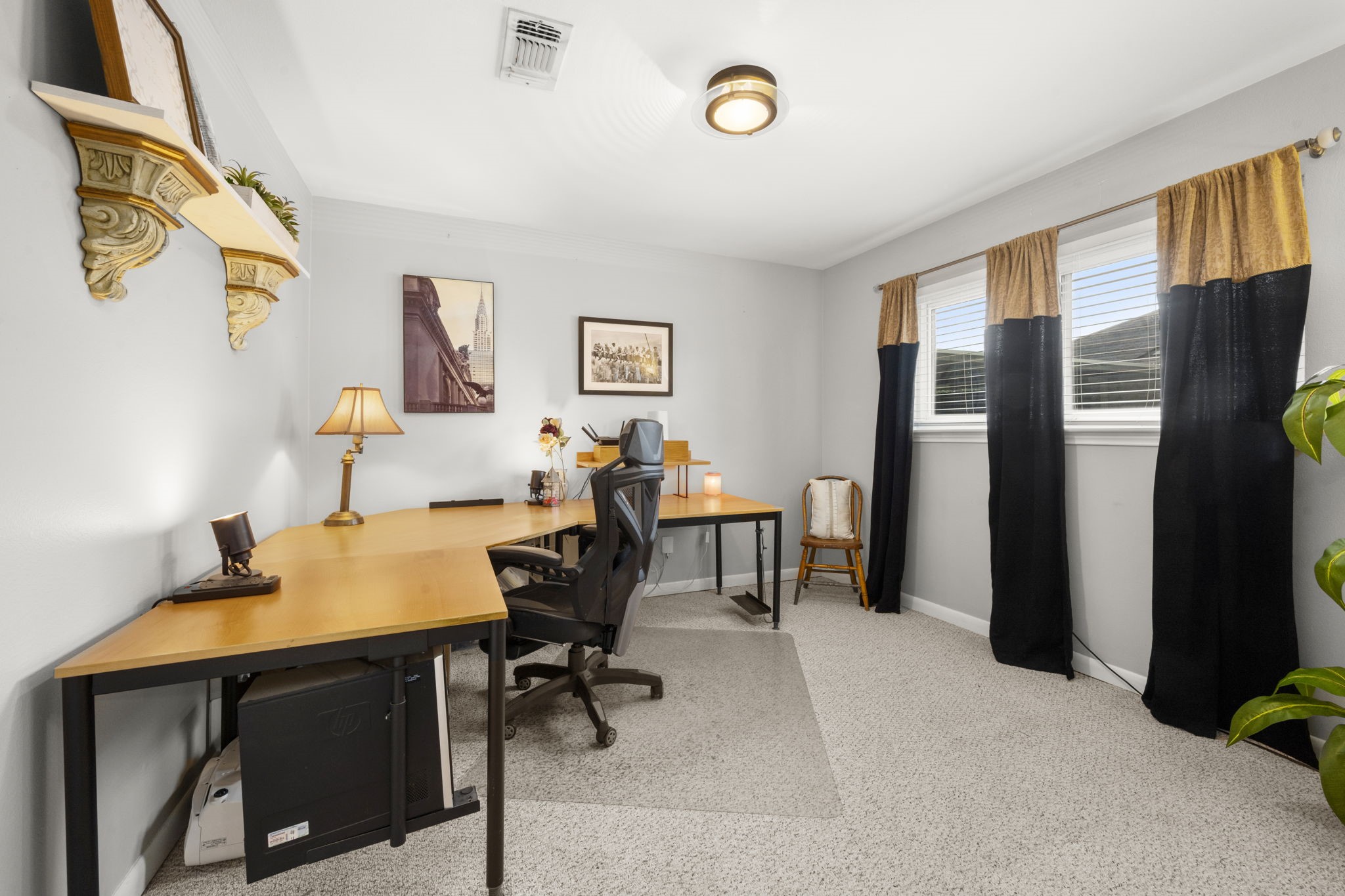 2506 Teague Road Houston, TX 77080 - Photo 9 of 33 a view of a workspace with furniture and a window