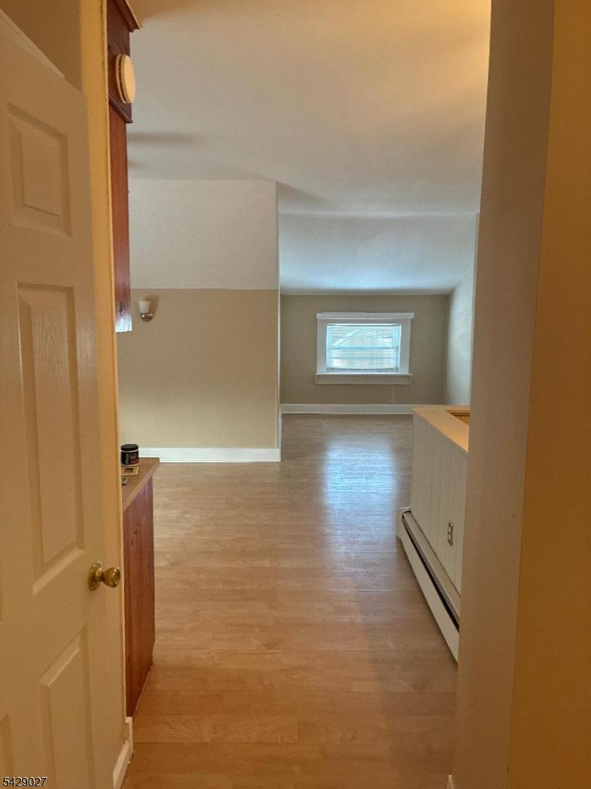 305 Penfield Place Dunellen, NJ 08812 - Photo 2 of 11 a view of an empty room and window
