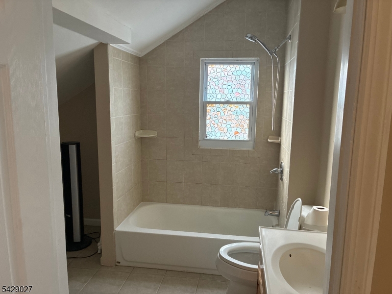 305 Penfield Place Dunellen, NJ 08812 - Photo 10 of 11 a white bath tub sitting next to a white toilet