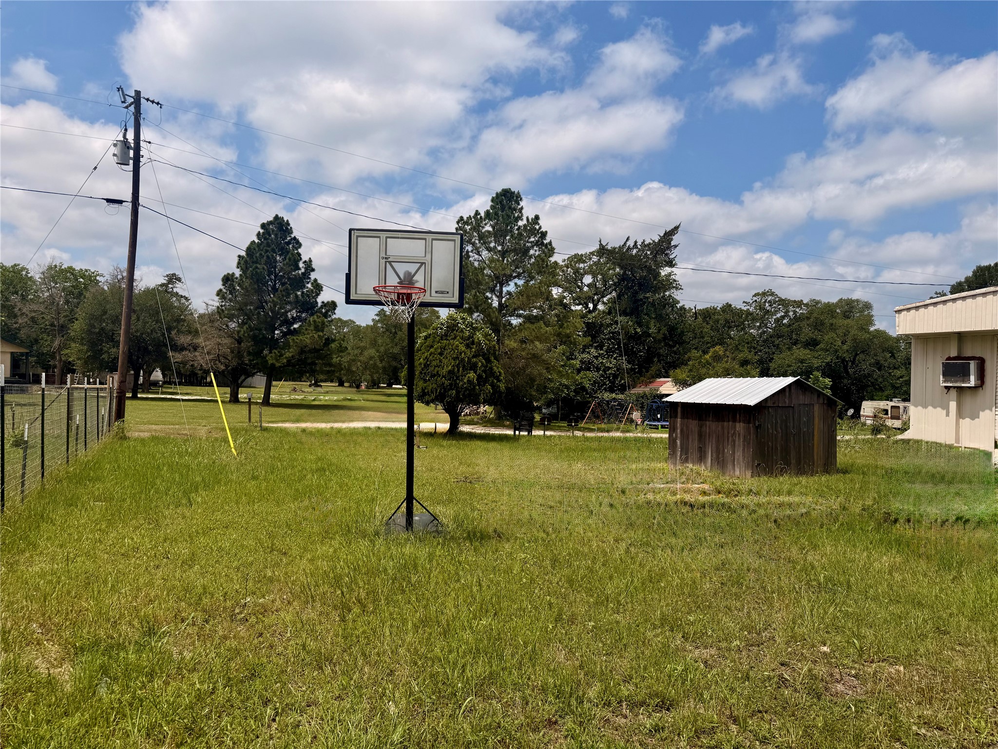 1940 Smoky Road Brenham, TX 77833 - Photo 8 of 14 a view of a house with a backyard