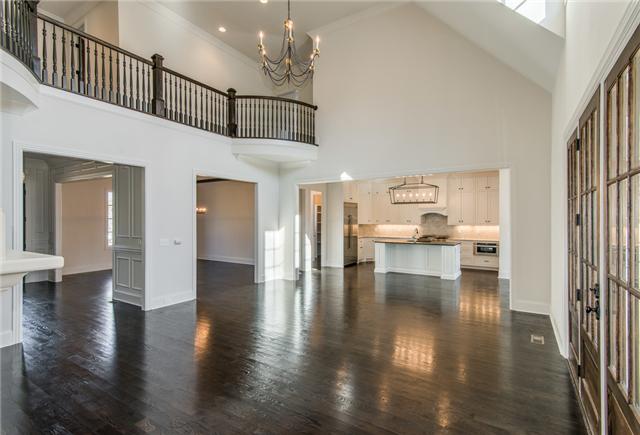155 Cheek Road Nashville, TN 37205 - Photo 4 of 20 The family room has a marble surround wood buring fireplace, is open to the kitchen and accesible to the covered back porch by a trio of french doors.
