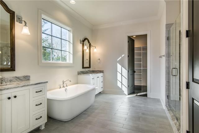 155 Cheek Road Nashville, TN 37205 - Photo 9 of 20 Elegant Clean lines compliment this large master bath complete with Carrerra marble counter tops and a fee standing soaker tub.