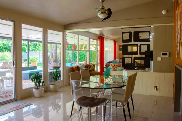 a view of a dining room with furniture window and outside view