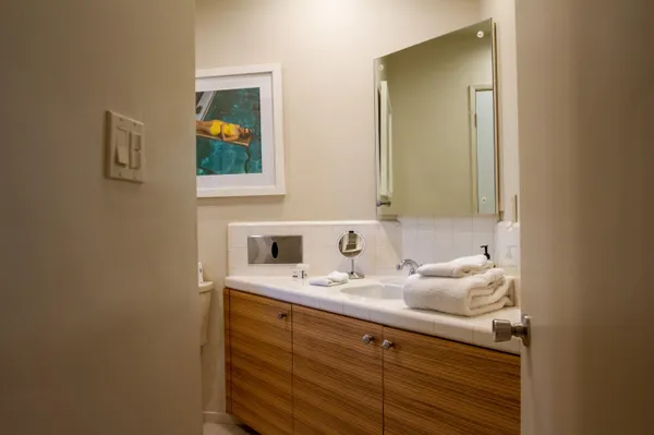 a bathroom with a sink and a mirror