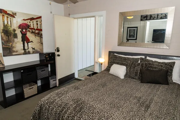 a bedroom with a bed and a television