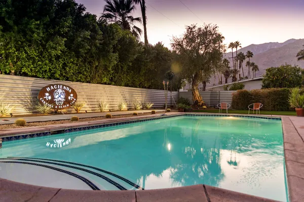 a view of a two chairs next to a yard