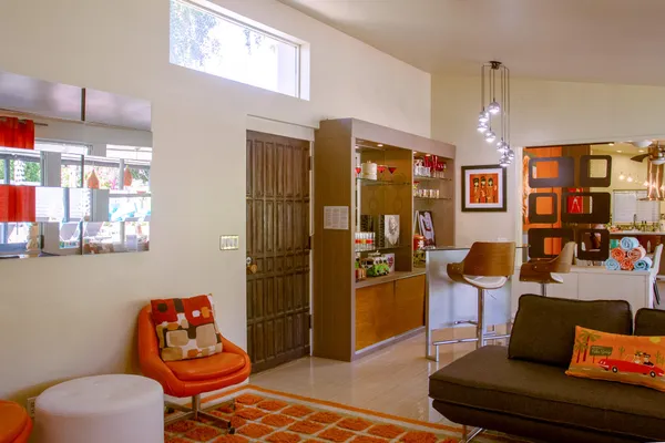 a living room with furniture rug and window
