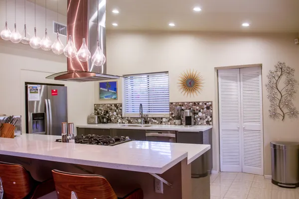 a kitchen with a table and chairs in it