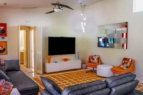 a living room with furniture and a flat screen tv